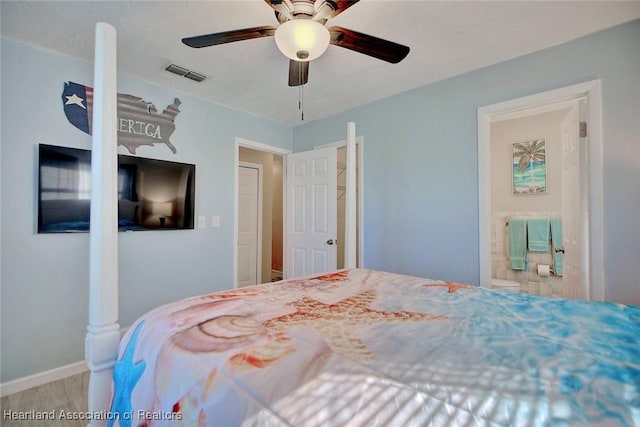 bedroom with ceiling fan and connected bathroom