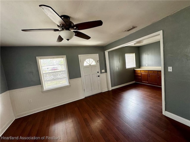 entrance foyer with dark hardwood / wood-style floors and ceiling fan