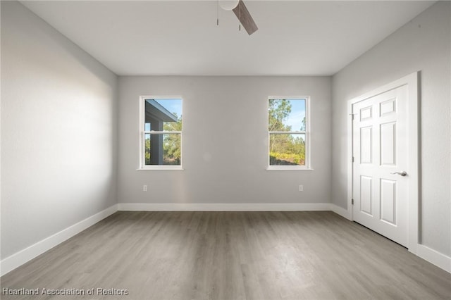 unfurnished bedroom with ceiling fan and light hardwood / wood-style flooring