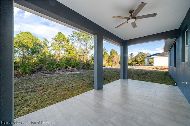 view of patio featuring ceiling fan