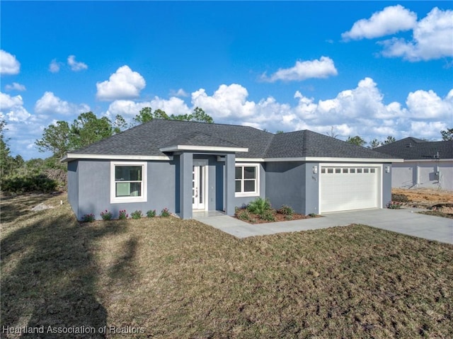 single story home with a garage and a front yard