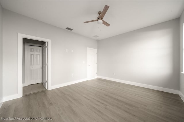 unfurnished room featuring wood-type flooring and ceiling fan