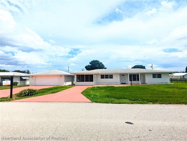 ranch-style home with a front yard and a garage