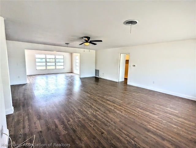 unfurnished living room featuring dark hardwood / wood-style flooring and ceiling fan