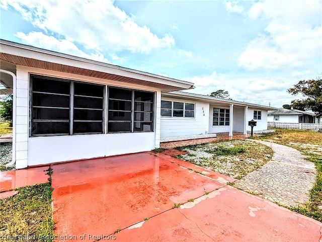 back of property featuring a patio area