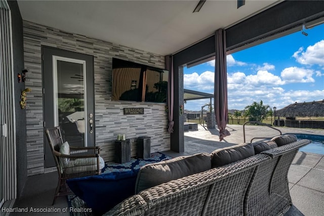 view of patio / terrace with a pool