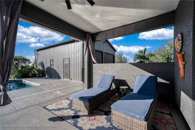 view of patio / terrace featuring ceiling fan