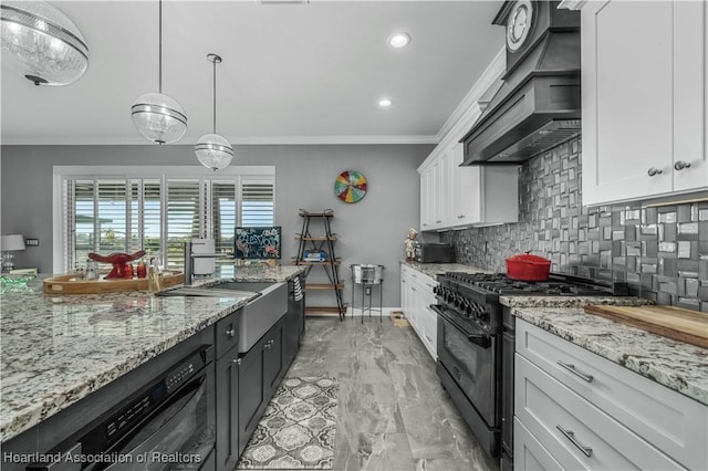 kitchen with white cabinetry, backsplash, decorative light fixtures, black appliances, and custom range hood