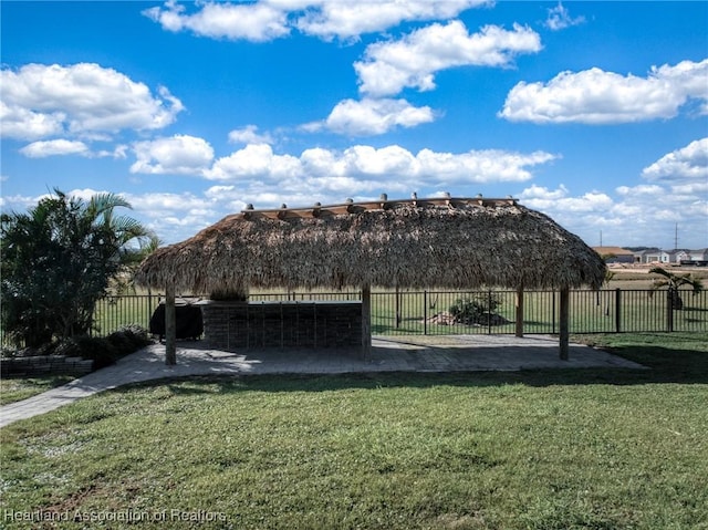 surrounding community with a gazebo and a lawn