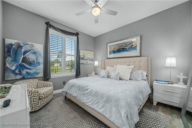 bedroom featuring ceiling fan and dark wood-type flooring