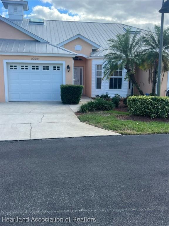 view of front of property with a garage