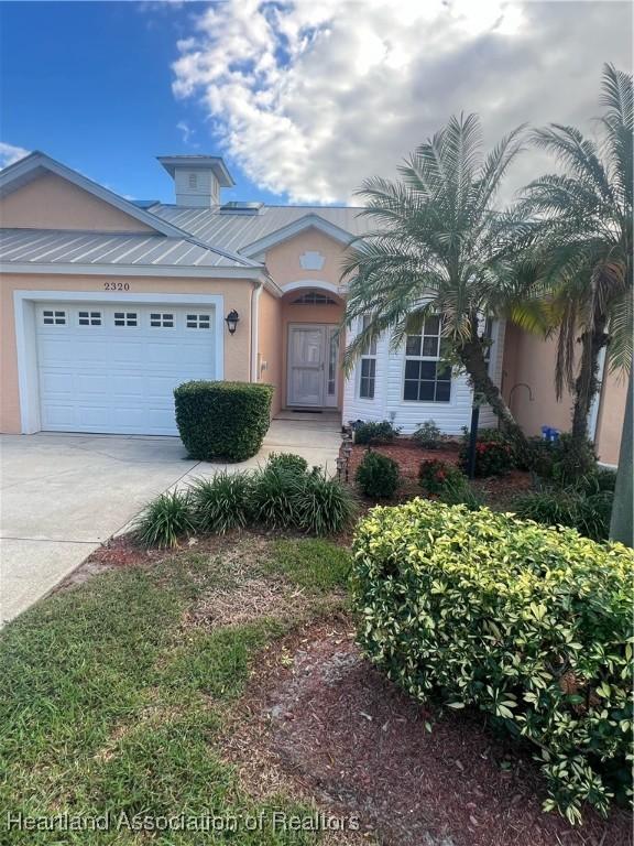 view of front of home featuring a garage