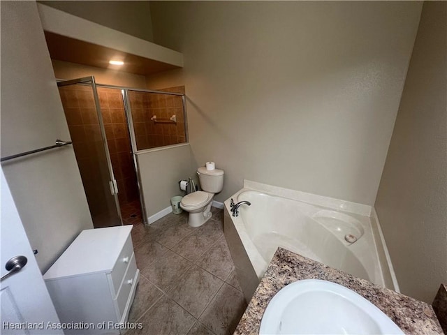 full bathroom featuring tile patterned floors, vanity, toilet, and shower with separate bathtub