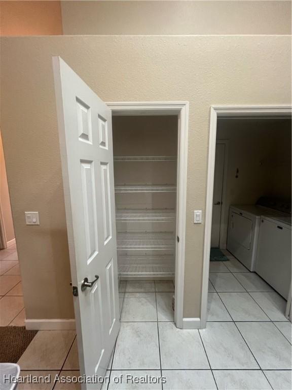 pantry with washing machine and clothes dryer