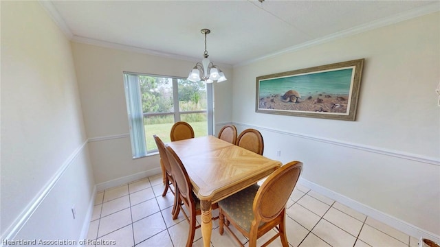 dining area featuring light tile patterned flooring, a chandelier, and ornamental molding