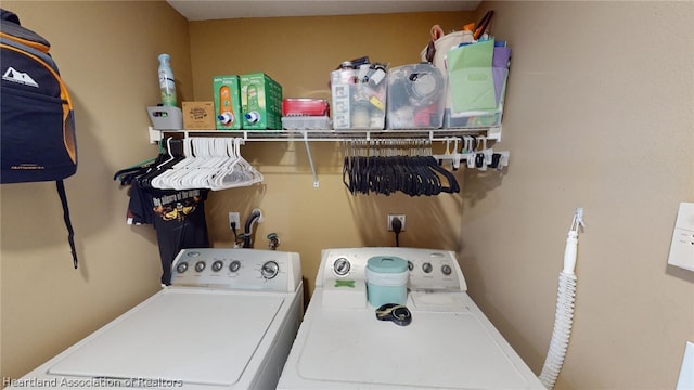 washroom with independent washer and dryer