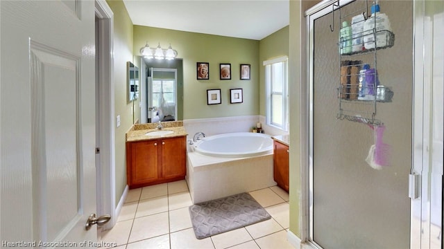 bathroom featuring tile patterned floors, vanity, and independent shower and bath