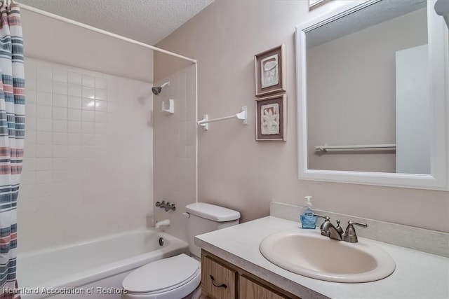 full bathroom with shower / bath combo with shower curtain, a textured ceiling, toilet, and vanity