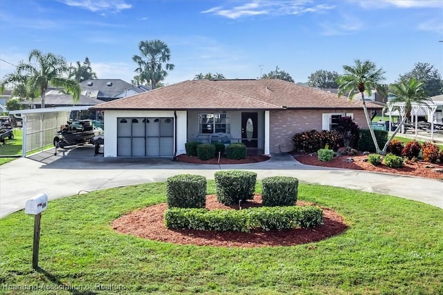 ranch-style house with a front yard and a garage