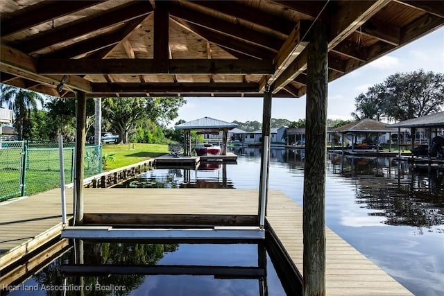 dock area with a gazebo and a water view