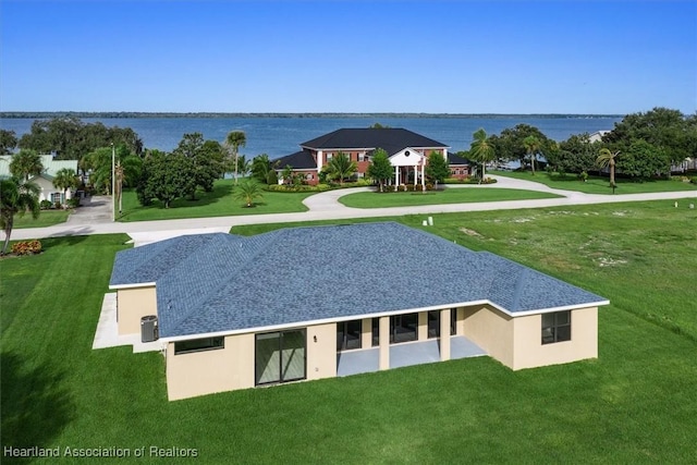 rear view of house with a water view