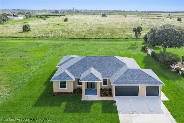 birds eye view of property featuring a rural view