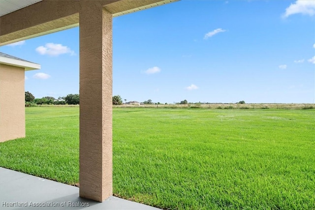 view of yard with a rural view