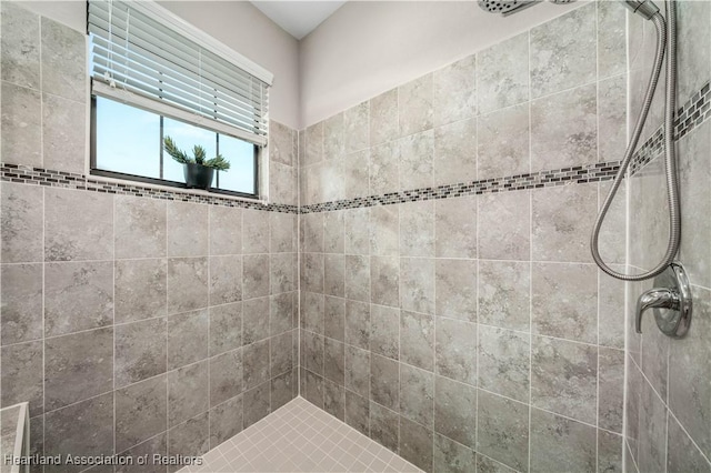 bathroom with tiled shower