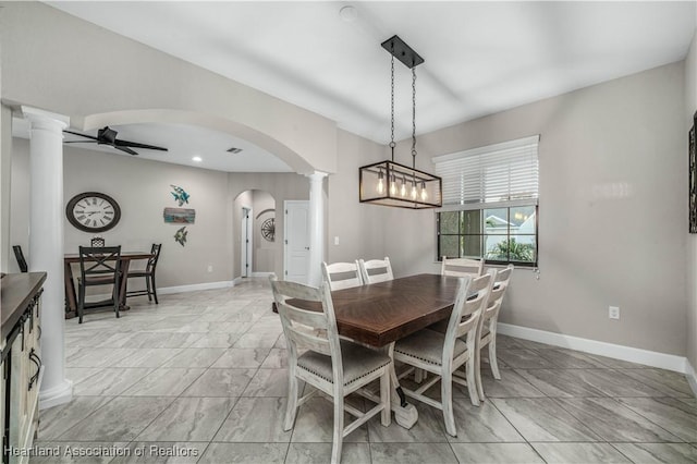 dining room with ornate columns and ceiling fan