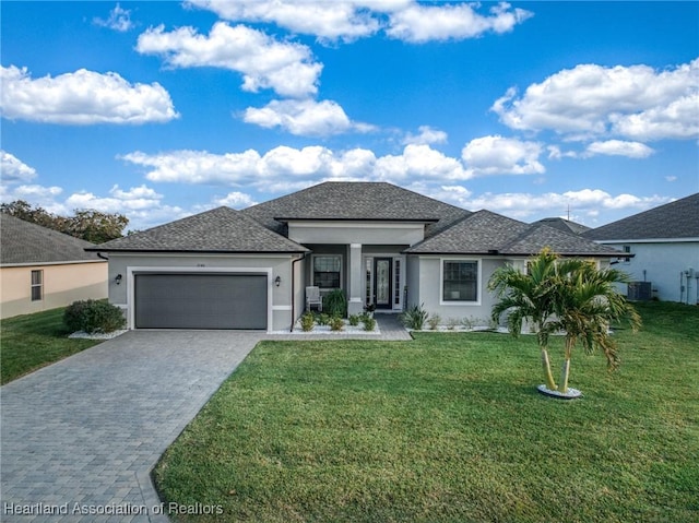 view of front of property featuring a garage and a front yard