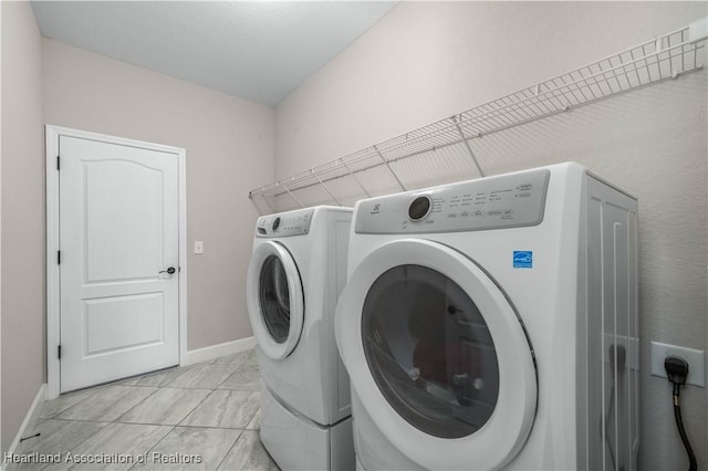 washroom with independent washer and dryer