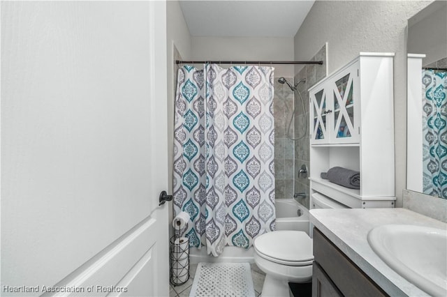 full bathroom featuring vanity, shower / bath combo, and toilet