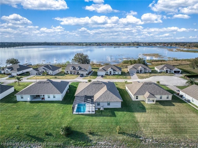 drone / aerial view with a water view