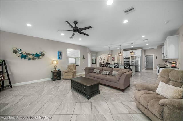 living room with ceiling fan