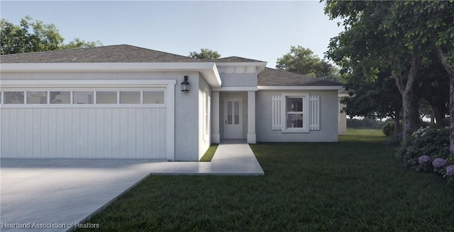 view of front of home featuring a garage and a front lawn