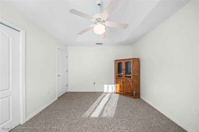 unfurnished bedroom with carpet floors and ceiling fan