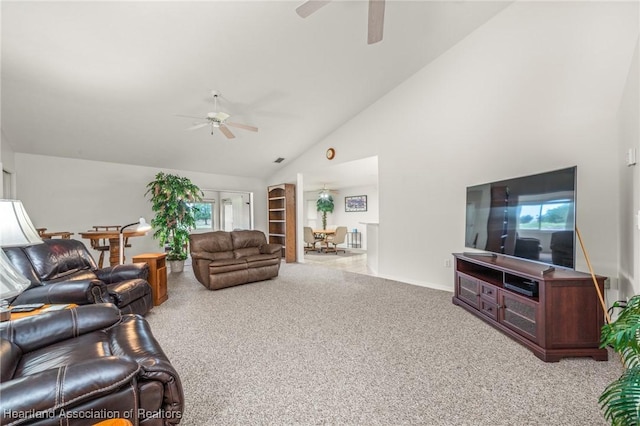 carpeted living room featuring ceiling fan and high vaulted ceiling