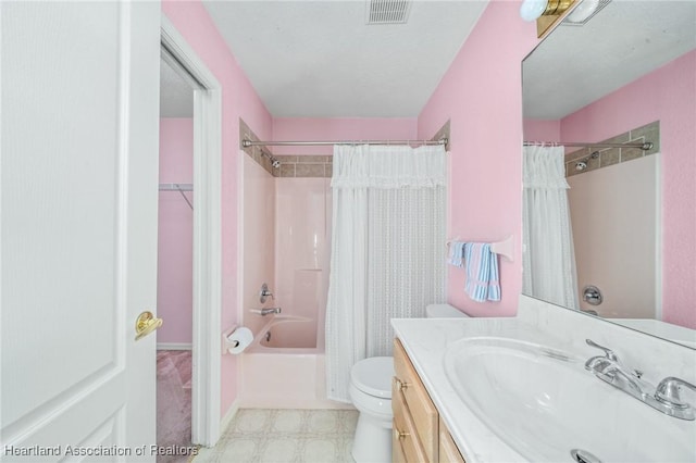 full bathroom with shower / tub combo with curtain, vanity, and toilet