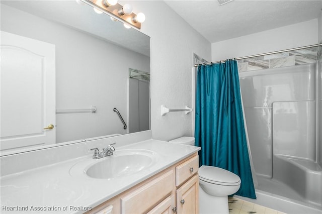 bathroom with a shower with curtain, vanity, a textured ceiling, and toilet