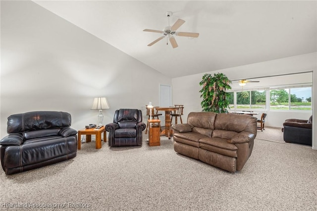 carpeted living room with vaulted ceiling and ceiling fan