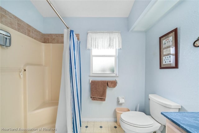 bathroom with walk in shower, vanity, and toilet