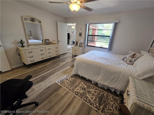1725 Amber Ln, Lake Placid, FL 33852 - bedroom with wood finished floors and ceiling fan