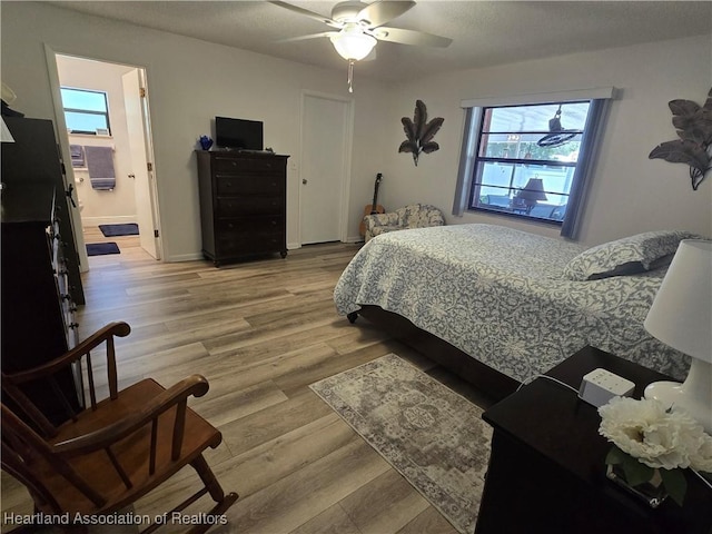 1725 Amber Ln, Lake Placid, FL 33852 - bedroom with light wood-type flooring, a ceiling fan, and ensuite bathroom