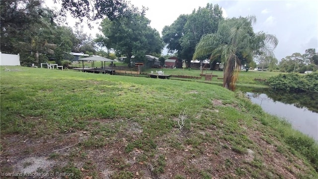 1725 Amber Ln, Lake Placid, FL 33852 - view of grassy yard featuring a water view