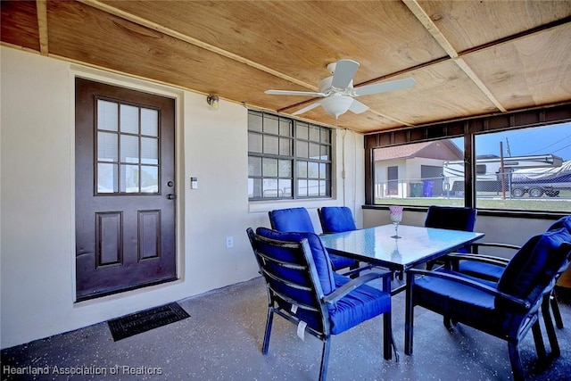 sunroom / solarium with wooden ceiling and ceiling fan