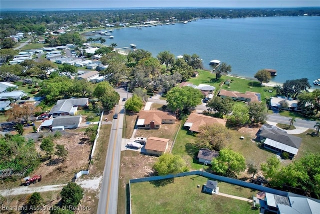 birds eye view of property featuring a water view and a residential view