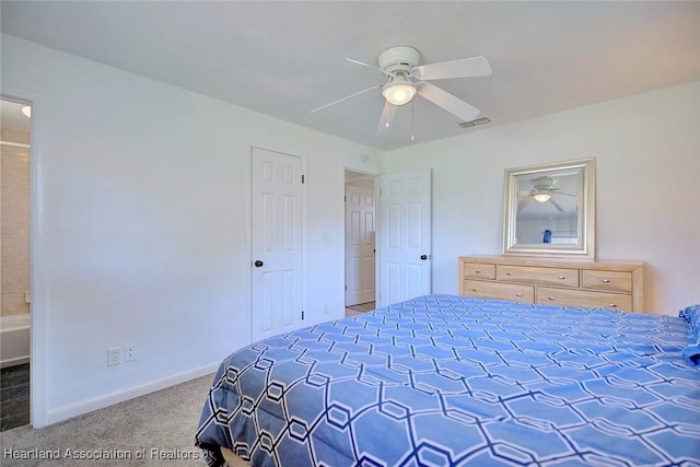 bedroom with visible vents, baseboards, a ceiling fan, ensuite bathroom, and carpet