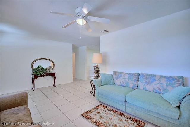 living area with ceiling fan, light tile patterned flooring, and visible vents