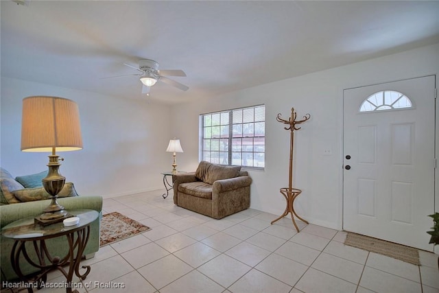 entryway with light tile patterned floors and a ceiling fan