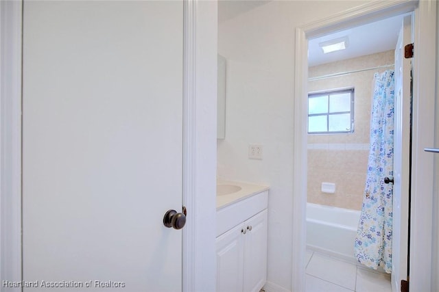 full bath featuring tile patterned floors, shower / bath combo, and vanity